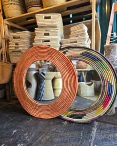 Multicoloured raffia mirrors Statement African décor accent ideal for restaurants, lodges, and resort interiors
