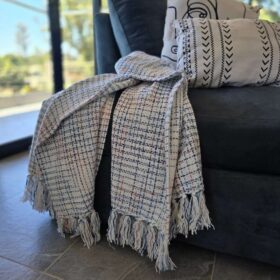 Summer throw blanket with tassels Statement African décor accent ideal for restaurants, lodges, and resort interiors