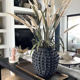 textired vintage vase Beautiful handcrafted home accessory adding warmth and texture to any space